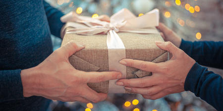 Someone gives a present to another