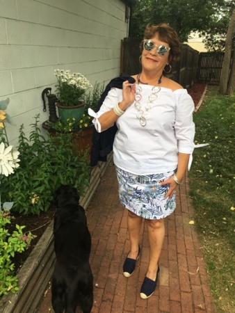 Theresa Montano standing with her guide dog