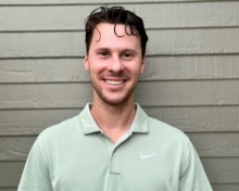 Grant Smith wearing a light green Nike e-shirt.